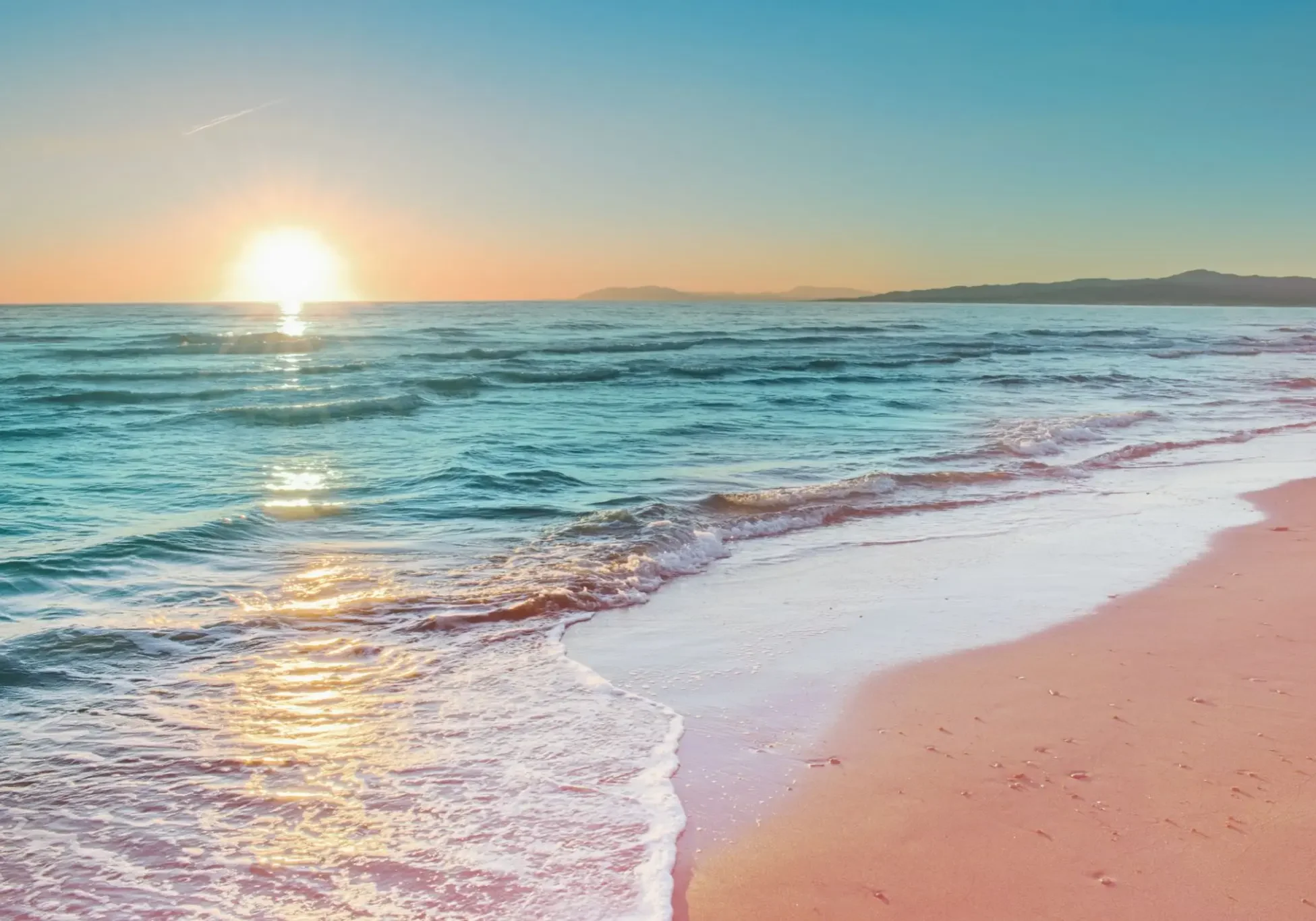 Serene beach with colorful sunset